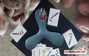 This poor guy loses a game of cards and has to let these two hotties fuck him in the ass and mouth with toys...
