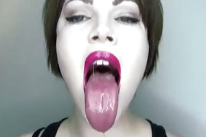 Her large mouth is just missing a monster cock cumming down her throat