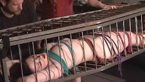 American goddess Carolina Pierce caged and spanked