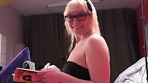 Blonde with glasses reads a book and sucks dick